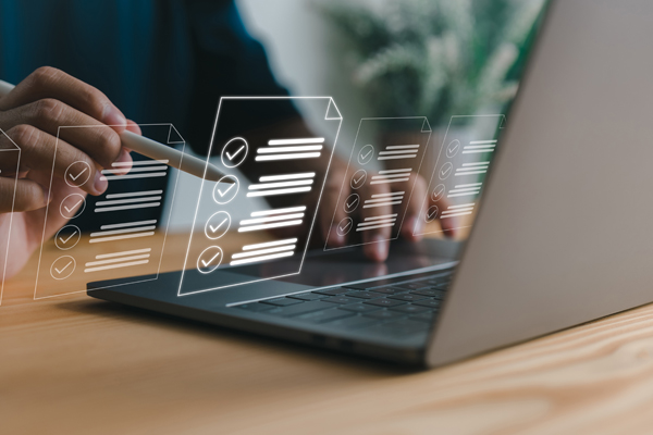 Person at laptop with checklist illustration overlay