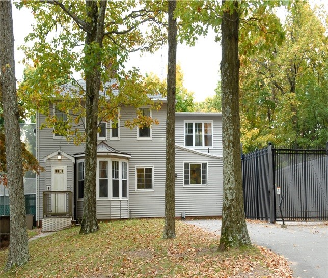 The exterior of the gray cottage at the Altobello Campus