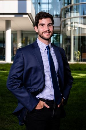 Person in a tie poses for a portrait