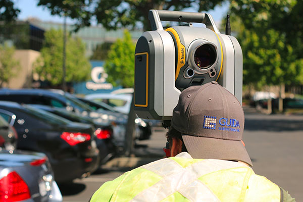 surveyor in a parking lot