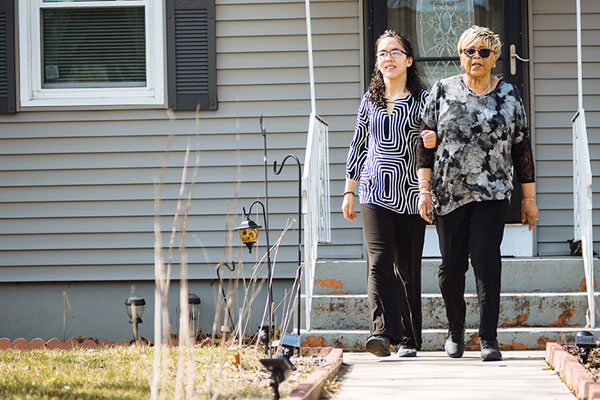women leaving a house