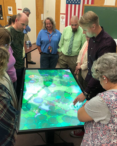 Jarkko Jokelainen showing DDS staff the intricacies of a Yeti tablet