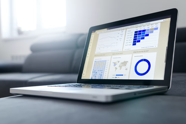 Laptop displaying graphs and charts