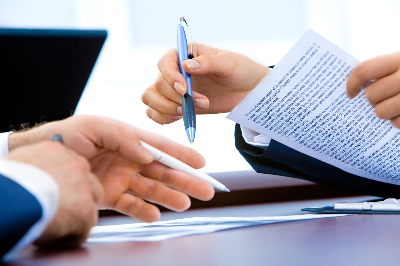 writing business forms on a desk