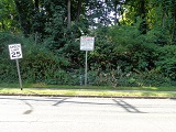 small picture of land and bid sign