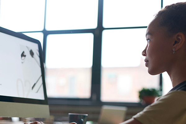 Image of woman in front of computer