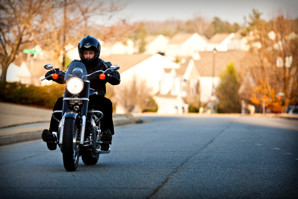 a biker is riding his motor cycle