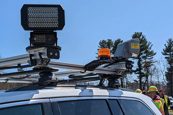 About Obey The Orange - Spotlight over a car in a workzone