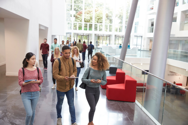 Student walking with mobile phones