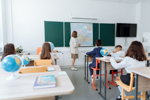 Teacher in front of classroom