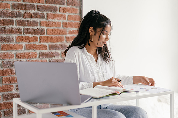 Young female teacher reviewing materials