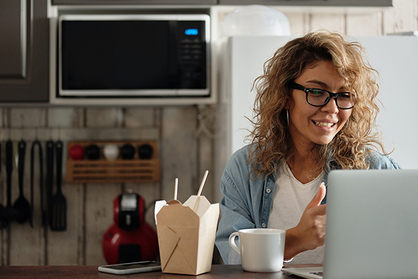 young woman at home with laptop
